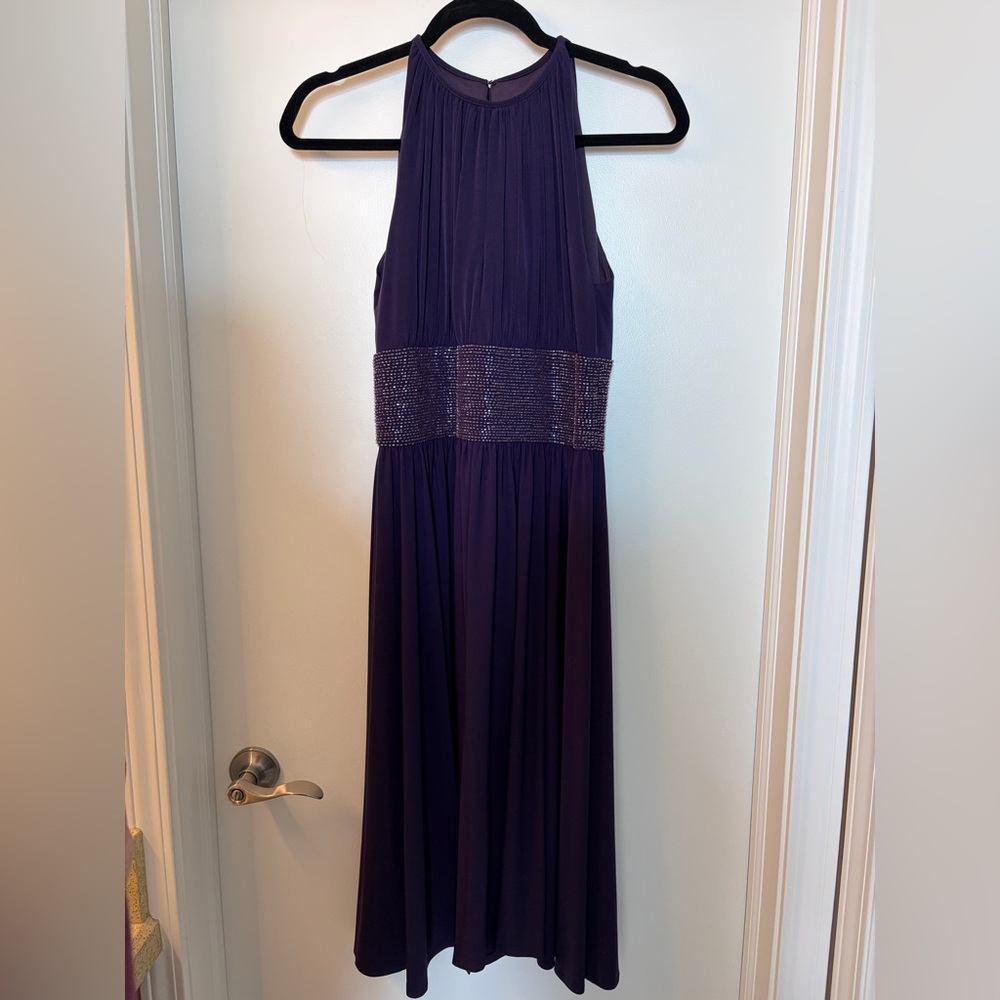Elegant Purple Halter Dress with embellishments around waist.

Nonsmoking home.